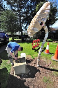 Poppy sculpture being installed in Cripplegate Park - designed by Living Mosaics